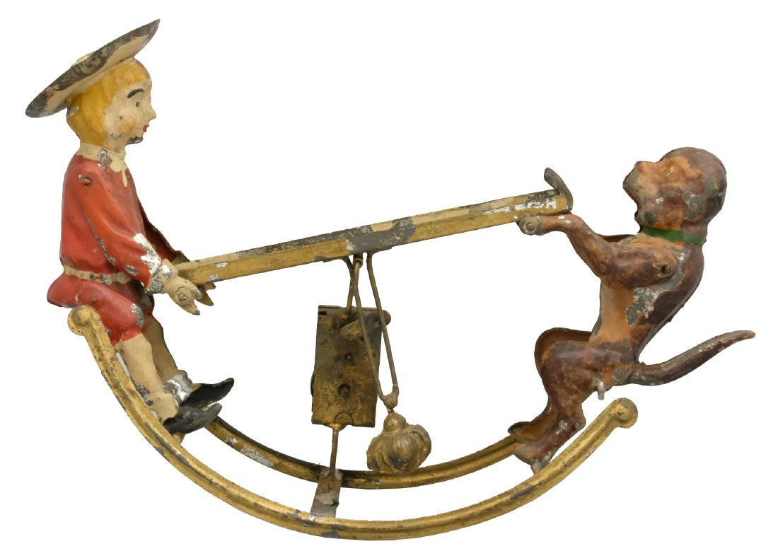 Buster Brown & Tige Marble Game: S.G. Gunthermann German - Circa 1910's - 10" L A classic German hand painted toy of Buster Brown and Tige of St. Louis Shoe fame! Material: Tin