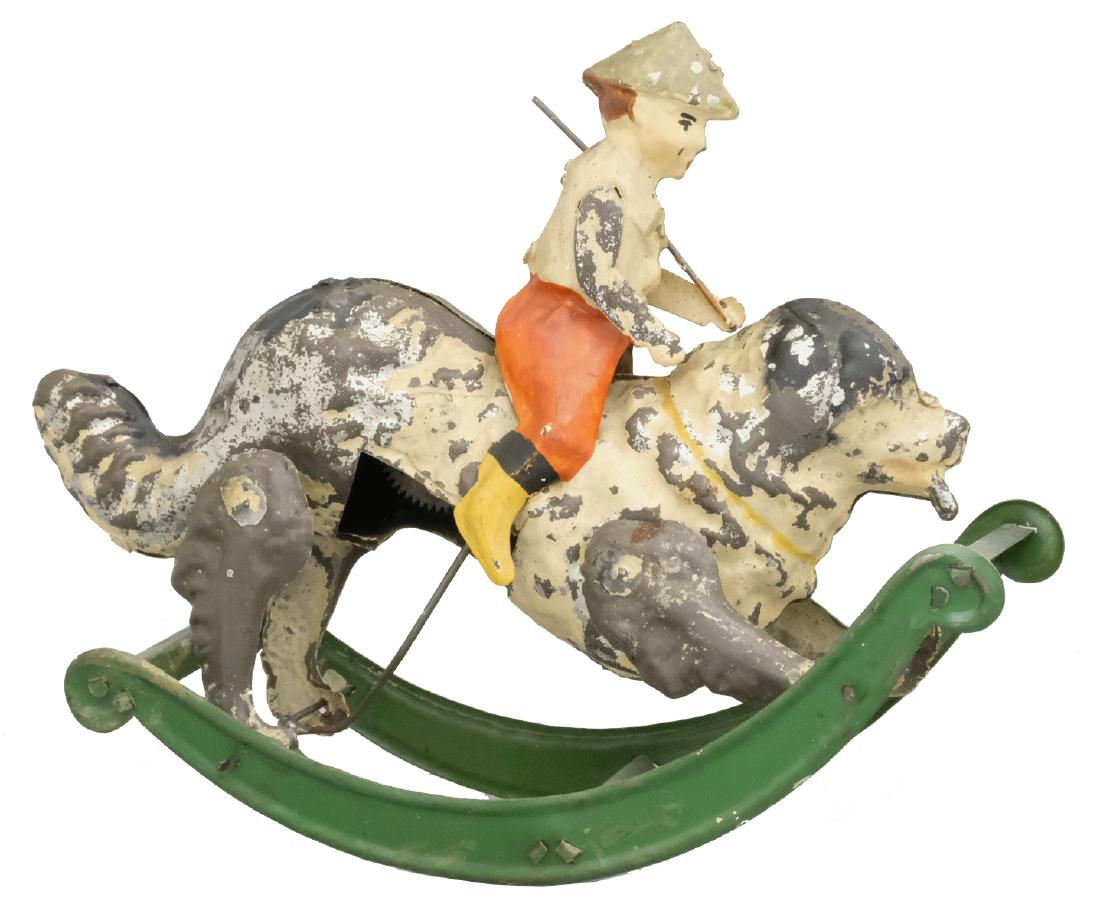 Boy on Dog on Rocking Base: S.G. Gunthermann German - Circa 1910's - 7.25" L Material: Tin