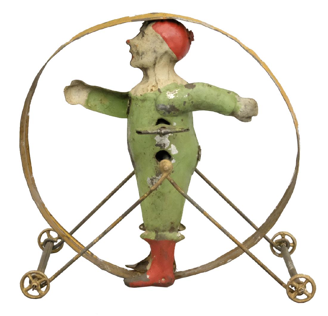 Clown in Hoop: S.G. Gunthermann German - Circa 1910's - 4.75" T Material: Tin