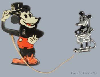 MICKEY MOUSE STRING TOY and MICKEY MOUSE PIN: MICKEY MOUSE STRING TOY and MICKEY MOUSE PIN - Both early pie eye versions of the famouse mouse; made in Germany circa 1928; string toy in EX condition with some surface rust o back; pin in VF conditi