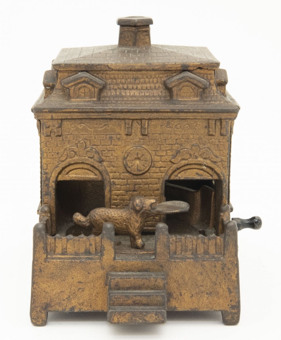 Dog on Turntable Iron Bank: H. L. Judd Mfg. of Wallingford, CT - 1895. Turn the crank and the dog enters the building and deposits the coin.Cast Iron. Very Good Condition.