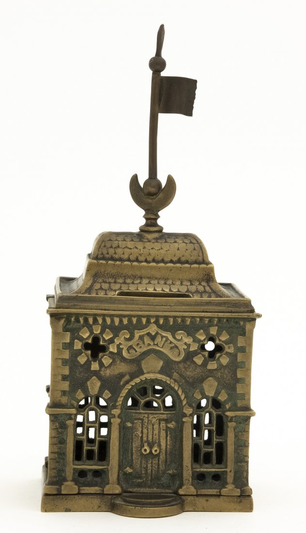 Savings Bank with Moon Finial Brass Bank: French - 1905 - 8 1/2" T. This is a scarce bank made in France based upon J. & E. Stevens Roof Bank. Brass. Pristine Condition.