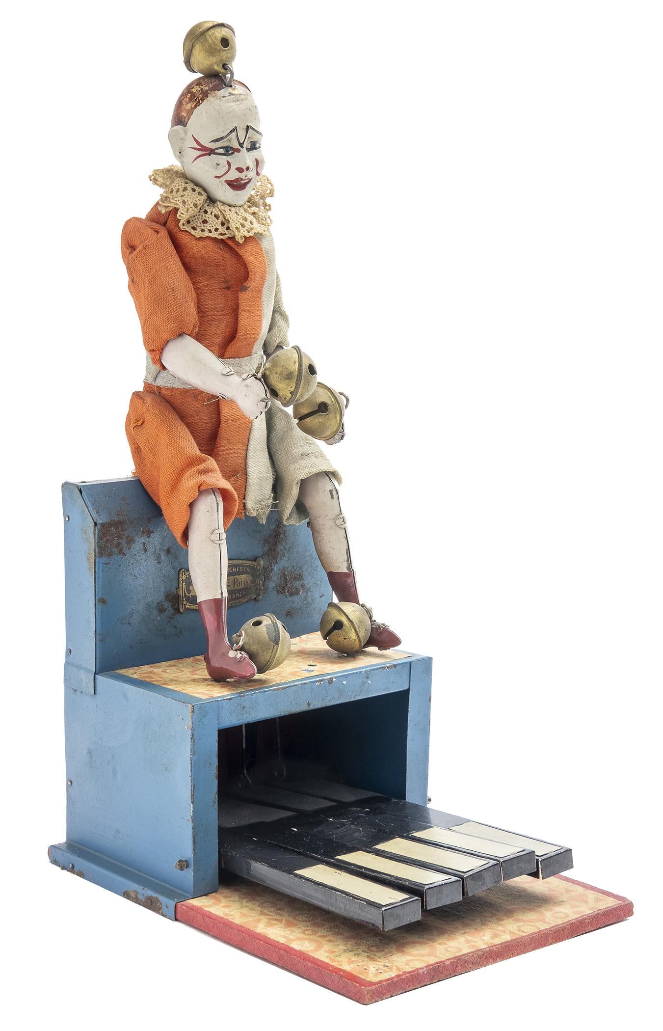 Victor Bonnet Clown on Top of Piano: French, Circa 1920's, 10.25" T This is an excellent and bright example of the toy.