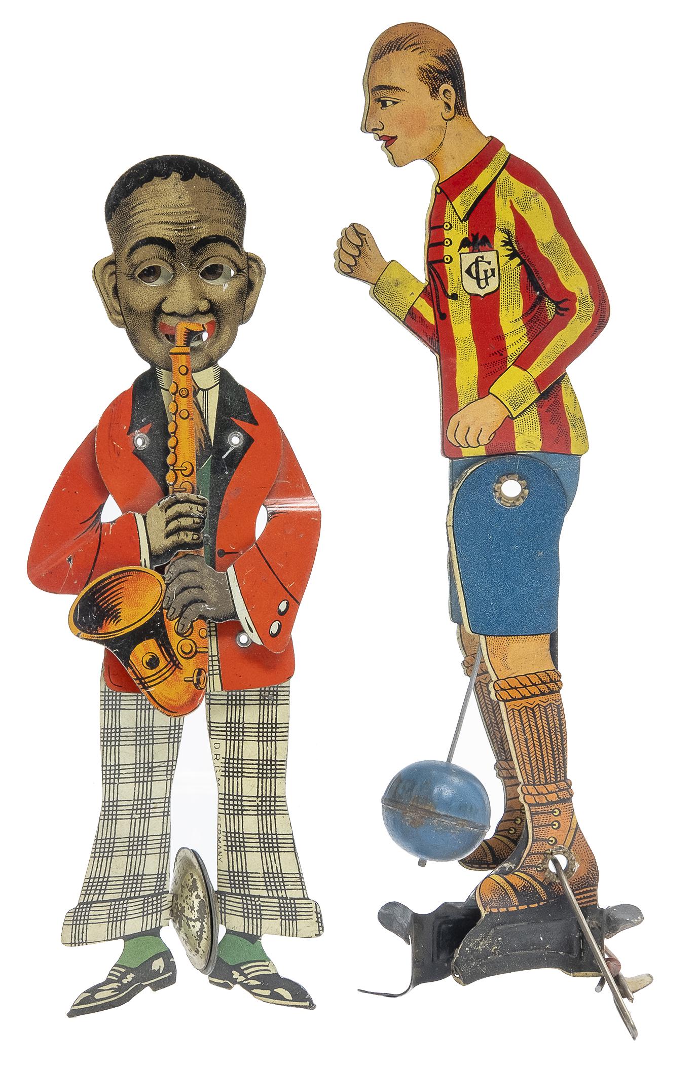 Carette Footballer and German Musician: German, Circa 1920's, 7.5/6.25" T Both hand operated toys are in pristine condition.