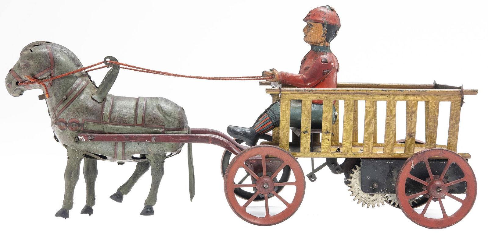 Hans Eberl Horse Drawn Trip-Trap: German, Circa 1915, 10.5" L We have never seen this charming toy before. Unlike its more common counterpart, it has only one seated figure. It is in superior condition, but the horse is missing its ea