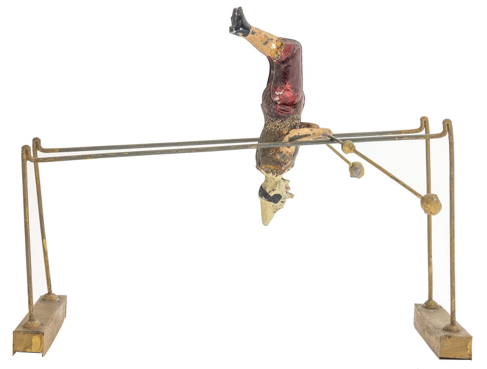 Clown on Inclined Parallel Bars: German, Circa 1915, 11.5" L This creative kinetic toy is quite colorful. Place him on the high side of the bar and give him a spin down the incline.