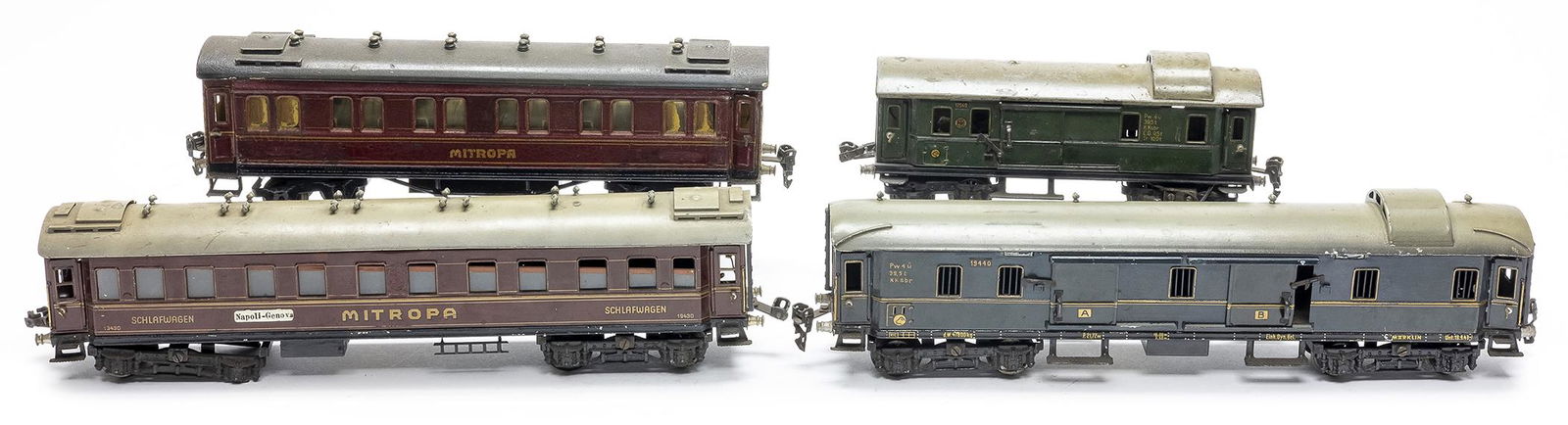 Four Marklin Train Cars: German, 10" - 16" L Includes: One Commercial, One Passenger, One Commercial, One Mitropa with Interior.