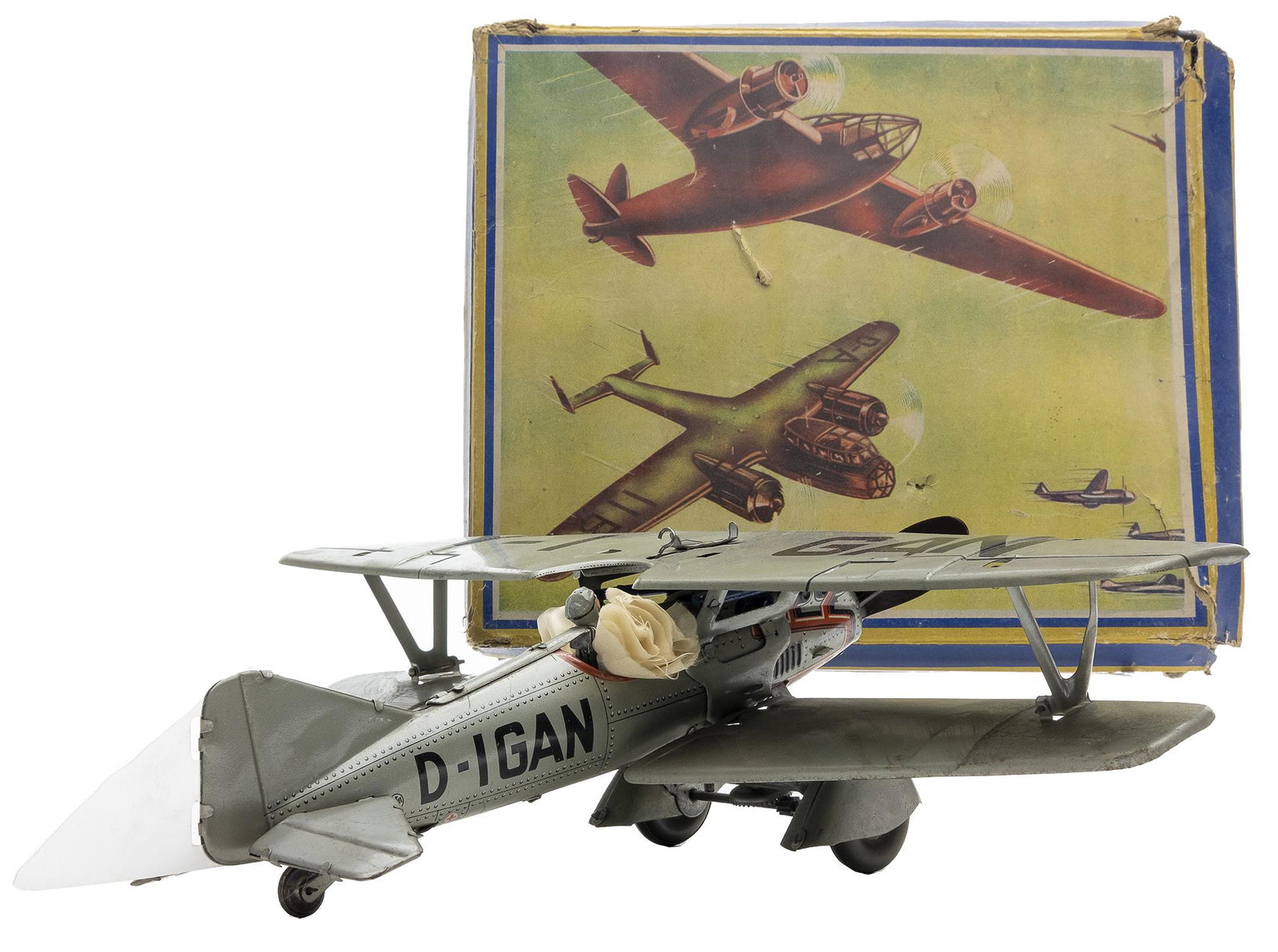 Tipp Co. German Fighter Bi Plane: German, 1930's, 12" L x 14" Wingspan The classic early German fighter plane with parachuting pilot.