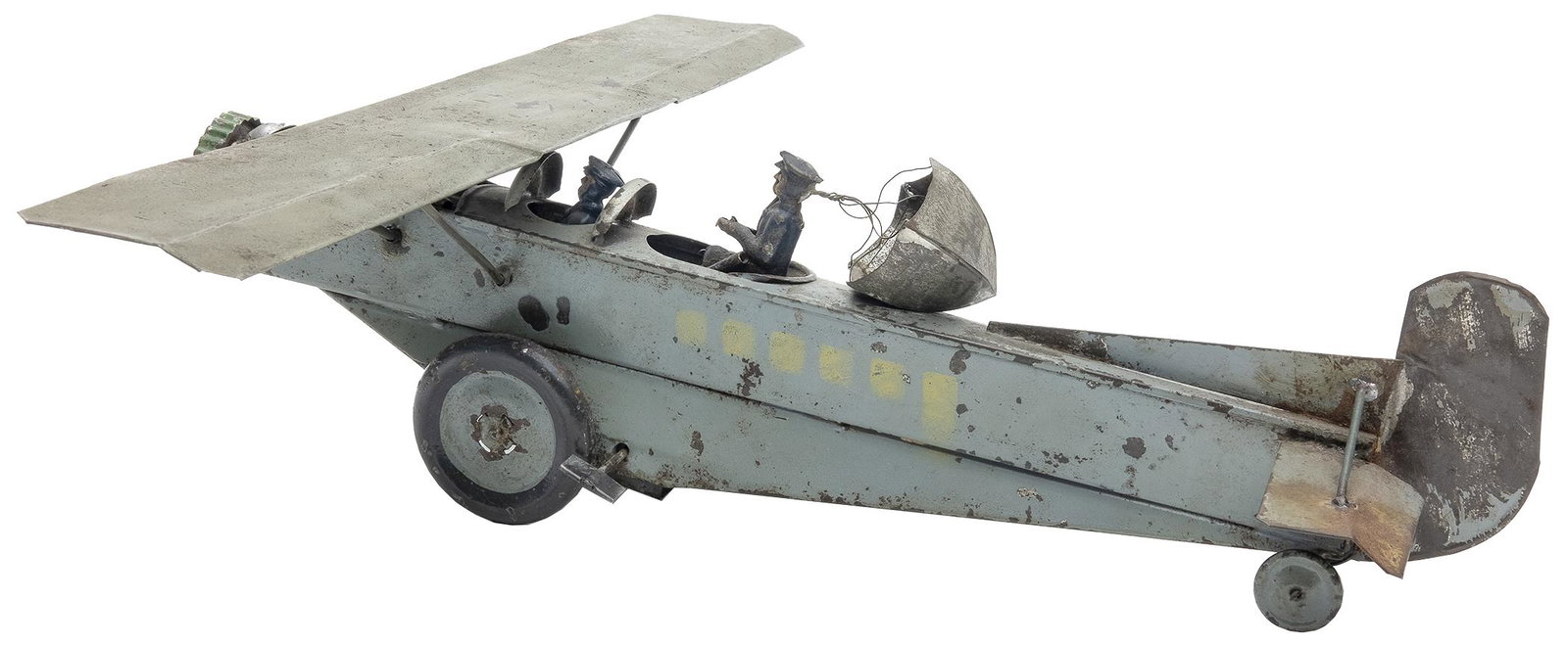 Paya Monoplane: Spanish, 1914, 15.5" L x 15.5" Wingspan An extremely early and rare Spanish toy by Paya. Made at the time of World War I. Complete with a figure that simulates parachuting from the plane.