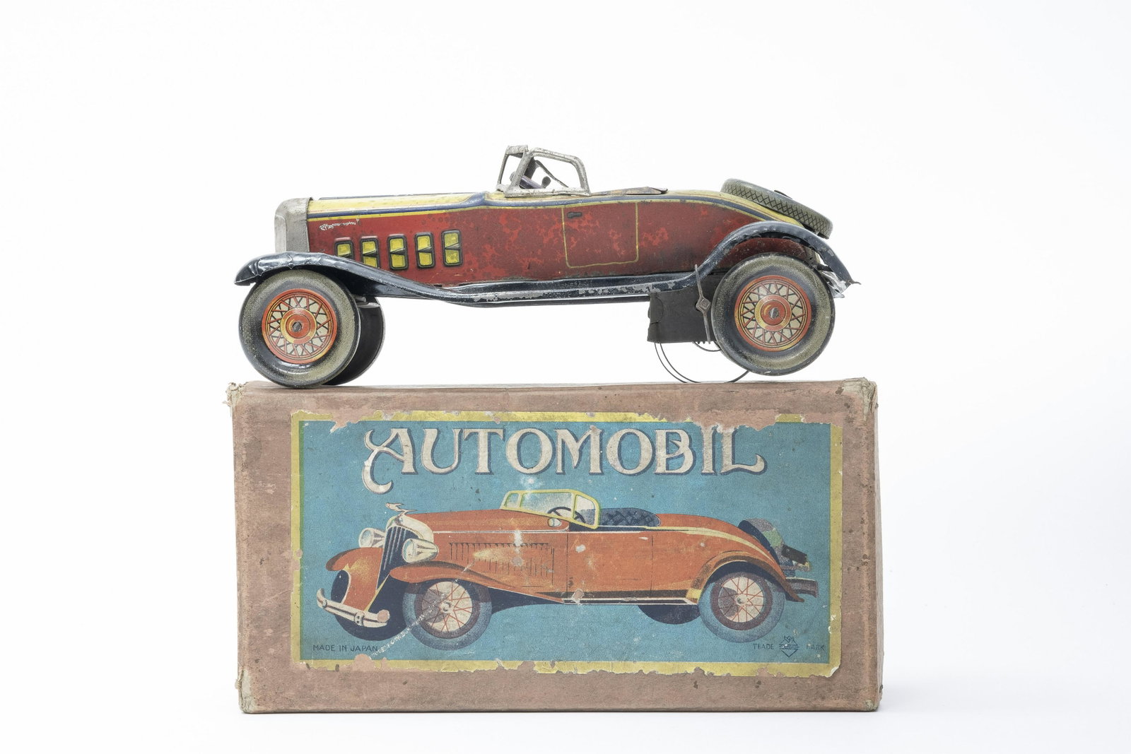 Marked "MY" Prewar Japanese "Automobil" with Box: Japanese - 1920's - 7" L In fair/good lithography. Mechanism does not work. Fair Condition (See Description)