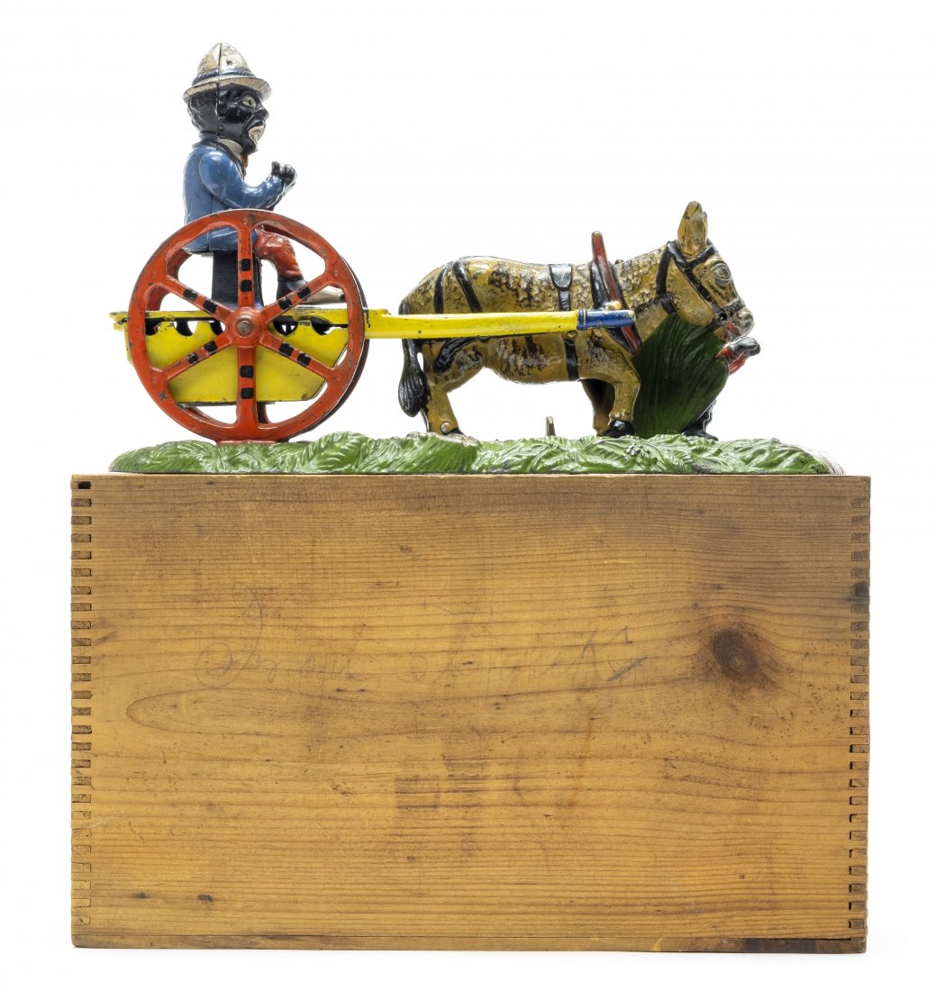 Bad Accident Iron Bank: By J. & E. Stevens Company Cromwell, CT - Circa 1888 Pristine Plus Condition with the Original Wood Box & Lid A farmer is seen driving his mule-drawn cart to market. Foolishly, he eats a slice of wate