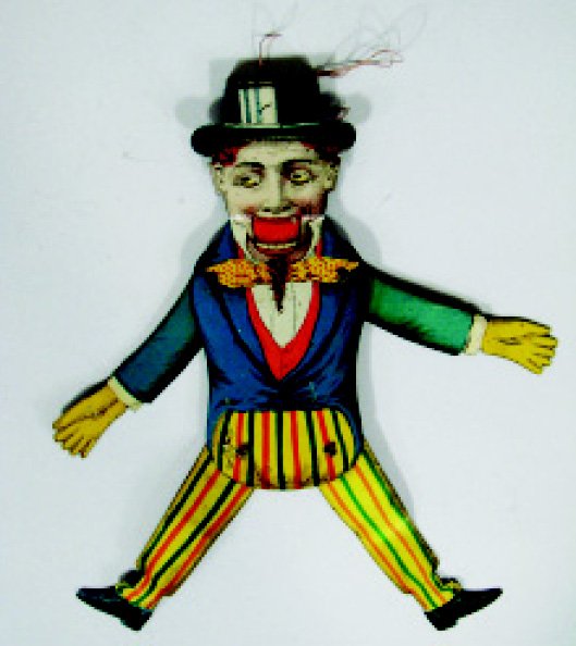 White Dandy String Toy: German – 1920's Material: Tin Condition: Very Fine, minor dents