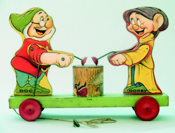 Fisher Price Dopey and Doc Drumming Toy: American – Dated 1937 An extremely early and very rare Fisher Price Toy, made for Walt Disney Enterprises in 1937. The toy is approximately 12" long, works well and retains its original pull string.