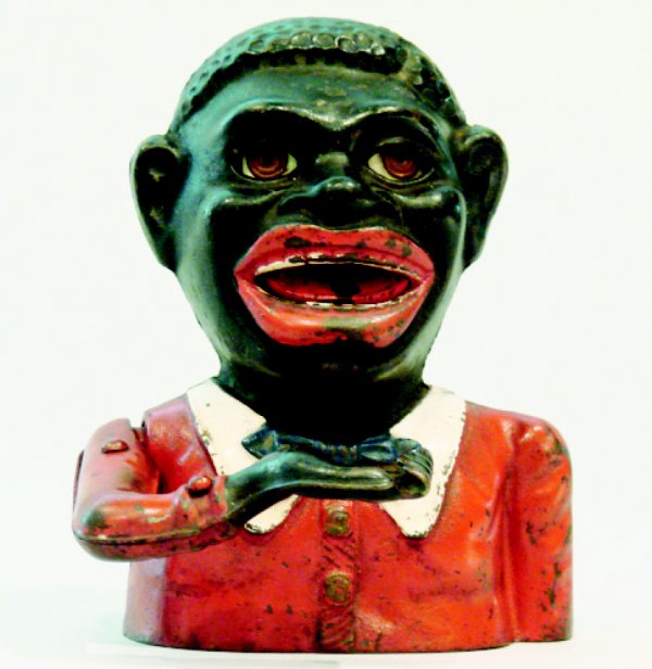 Jolly N., English Mechanical Bank: A classic bank made by Starkies of England circa 1920. Place a coin in his hand and press the lever on his back. Your coin is swallowed. Material: Cast Iron Condition: Excellent