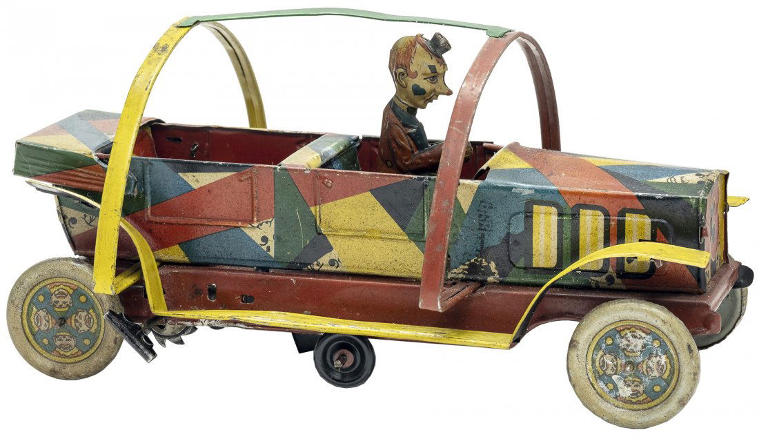 Clown Rollover Car Tin Windup Toy: By Hans Eberl German - 1920 - 10.5" L Very Fine Condition This is a fantastic and colorfully lithographed toy. As it moves along a pole descends, gently rolling over the vehicle. It still works well.