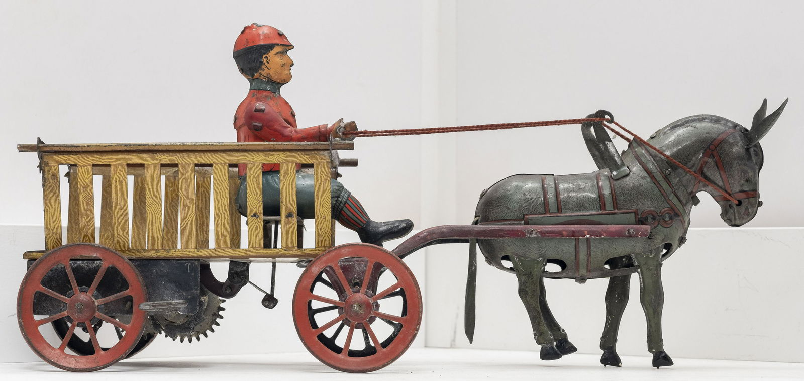 "Tripp Trapp" Donkey Dray: Made by Hans Eberl German - 1920 - 11" L Excellent Condition This is an extremely scarce and desirable German windup toy. Tripp-Trapp toys are usually made with two human figures and no donkey. This i