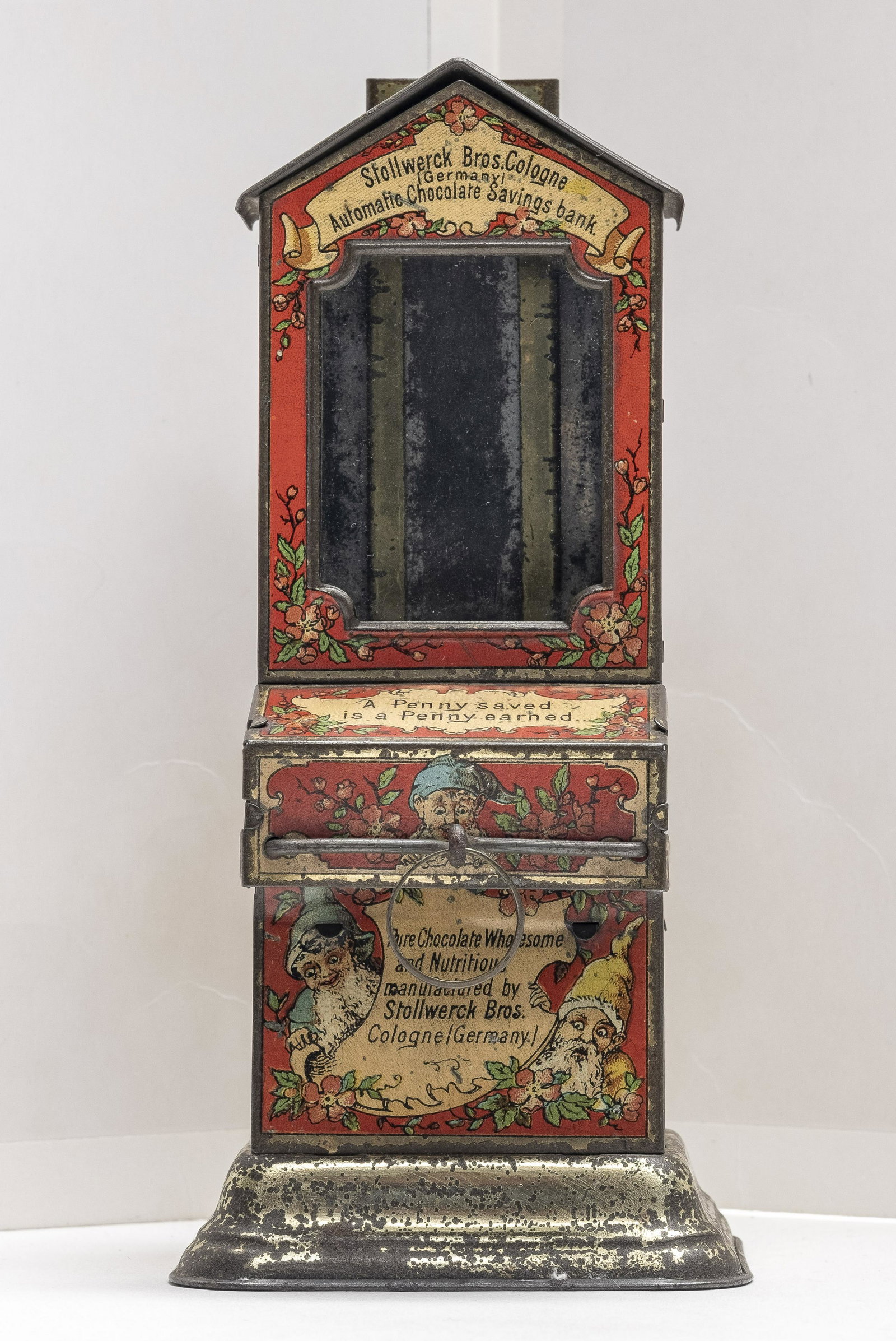 Automatic Chocolate Savings Bank: Decorated with Small Comical Elves Made by Stollwerck Bros. Company Cologne, Germany - Circa 1900's Excellent Lithography & Patina