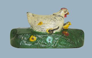 Hen and Chick Bank, White Hen Mechanical Bank: Made by the J. & E. Stevens Company Cromwell, Connecticut--Circa 1901 Place a coin in the slot in front of the hen. Raise the lever, the hen crows and a baby chick comes out from under her warm, fuzzy