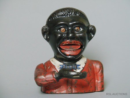 Little Joe Mechanical Bank: Made by John Harper & Co. Ltd. Willenhall, England – Circa 1925 An English coin swallowing bank. Material: Cast Iron