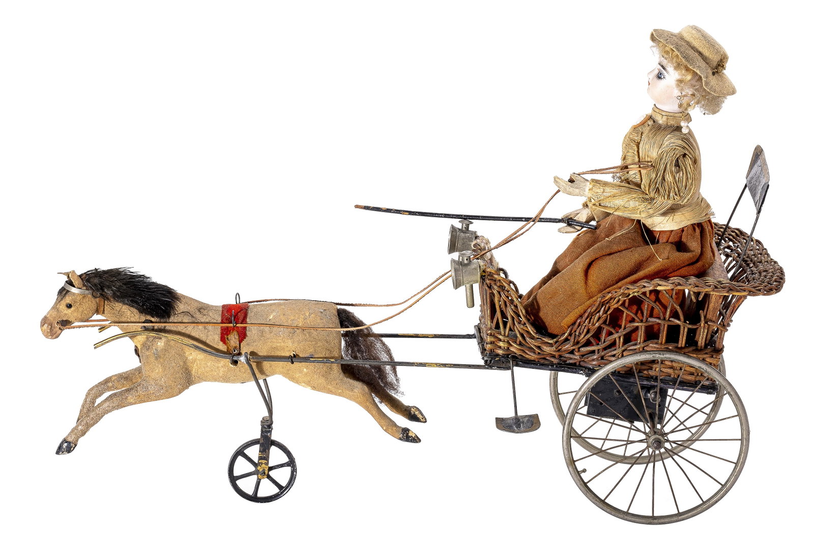 Wicker Bodied Pony Cart: French - 1890 - 17" Long. This is a very fragile toy that is in good working condition. Her head is made of porcelain and she has a silk blouse (slightly torn).