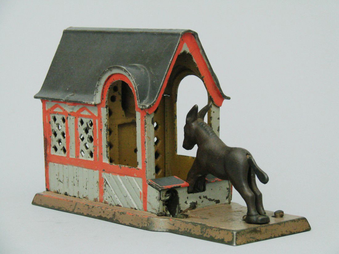 Mule Entering the Barn, Grey: Mule Entering the Barn, Grey -Made by the J, & E, Stevens Company Cromwell, Connecticut – Circa 1880 Place a coin between the mule's hind legs. Then press the lever and the mule somersaults over and