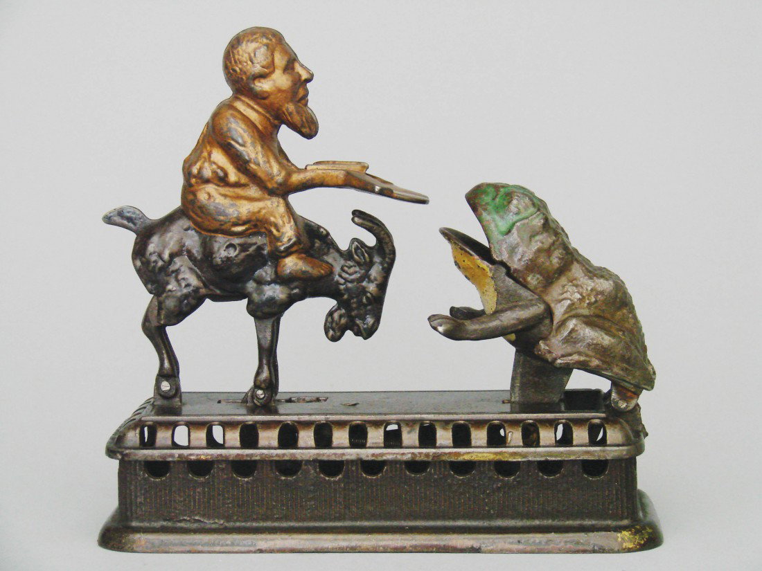 Initiating Bank – 2nd Degree: Initiating Bank – 2nd Degree -Made by Mechanical Novelty Works New Britain, Connecticut – Circa 1885 Also known as the "Goat, Frog and Old Man". It functions by placing a coin in the man's tray an