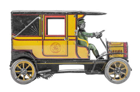 Taxi Cab Tin Toy: By Burnett Ltd. London, England - 1920 - 7 1/4" Long. We have never seen another example of this scarce early Taxi Cab. It maybe unique.