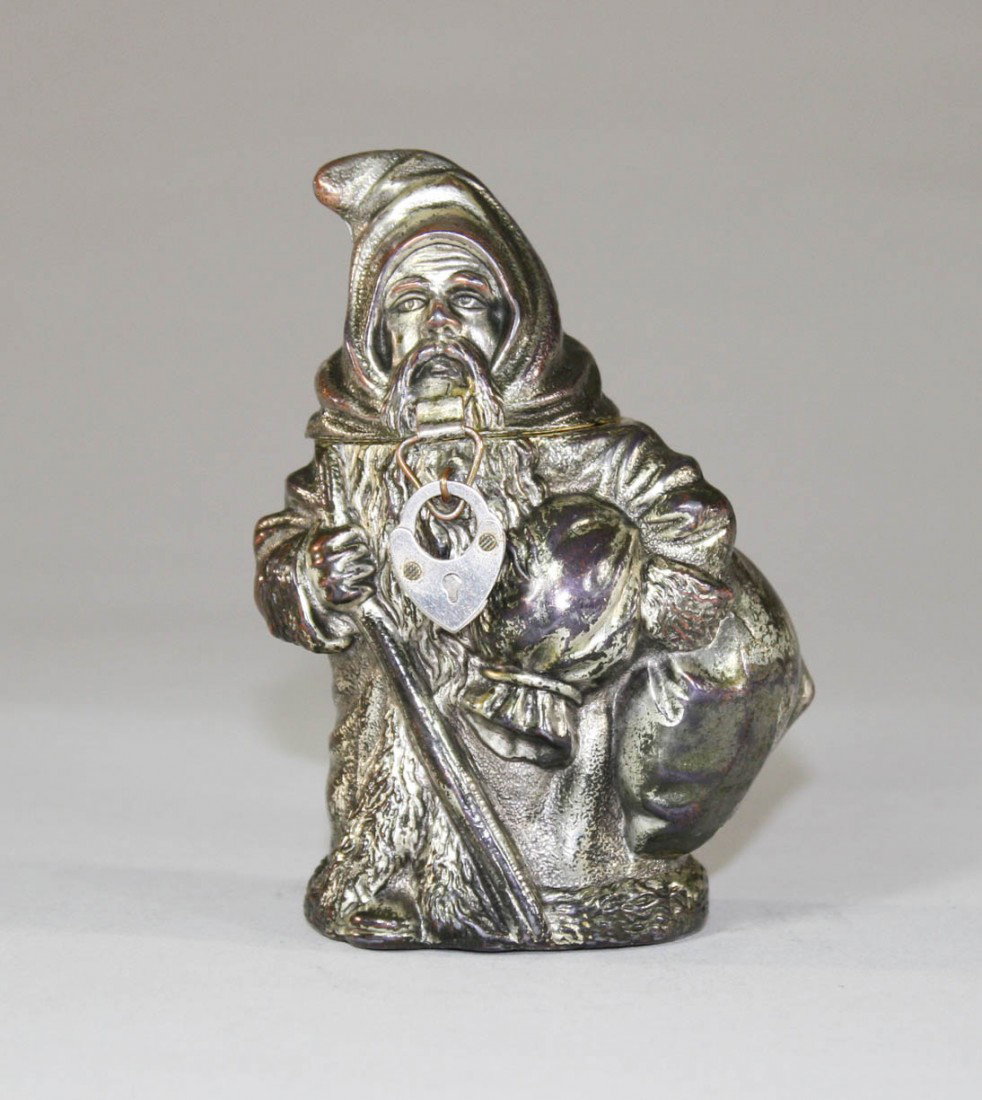 Santa with Satchel Silver Plated Bank: Germany – Circa 1910 A scarce and graphic bank depicting "Old St. Nicholas". Hinged head to retrieve your coins.