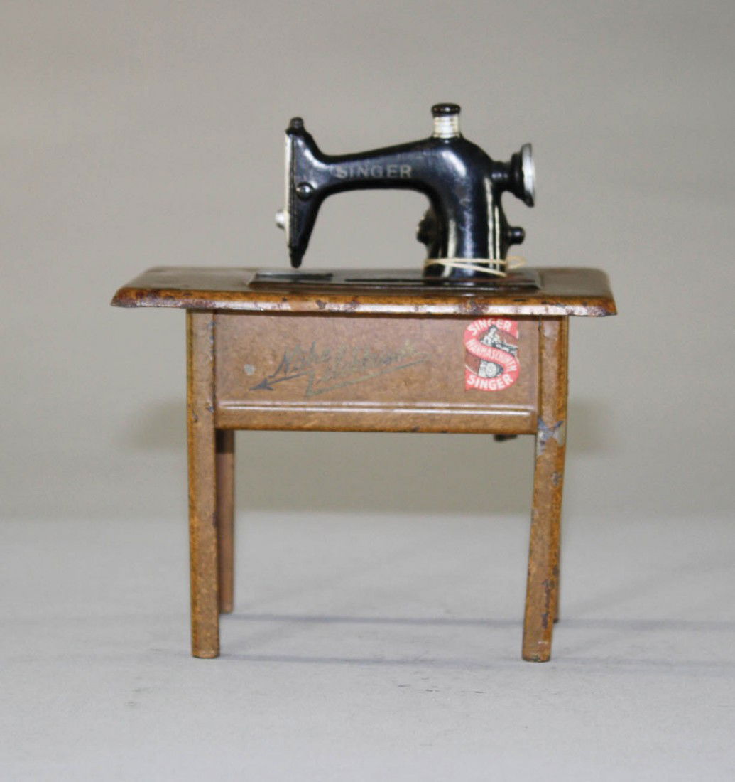 Singer Sewing Machine Still Bank: Germany – Circa 1925 The later version of the bank. Material: Sheet Steel or Tin
