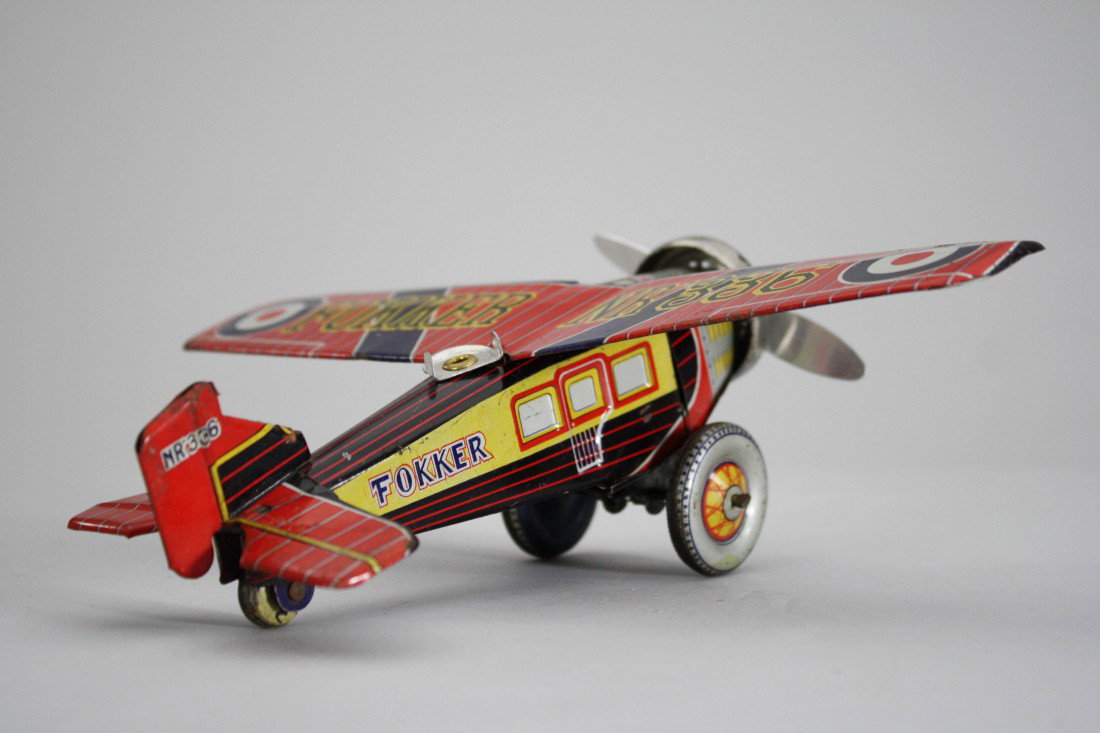 Fokker Windup Airplane: Marked "Made in Japan" – Circa 1935 This toy has great lithography and works very well. It is 7 ½" long and has a 9 ½" wingspan. Material: Tin