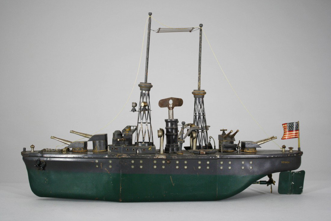 Orkin Battleship: Made by Orkin Mfg. American – Circa 1925 This is a fantastic 24" battleship with long winding action (10 minutes). Orkin boats were made between the wars. Material: Tin, Wood and Wire