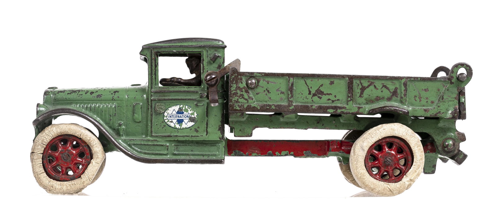 International Dump Truck - Cast Iron Toy: Made by Arcade Mfg. Company. Freeport, Illinois - 1930. 10 1/2" Long.