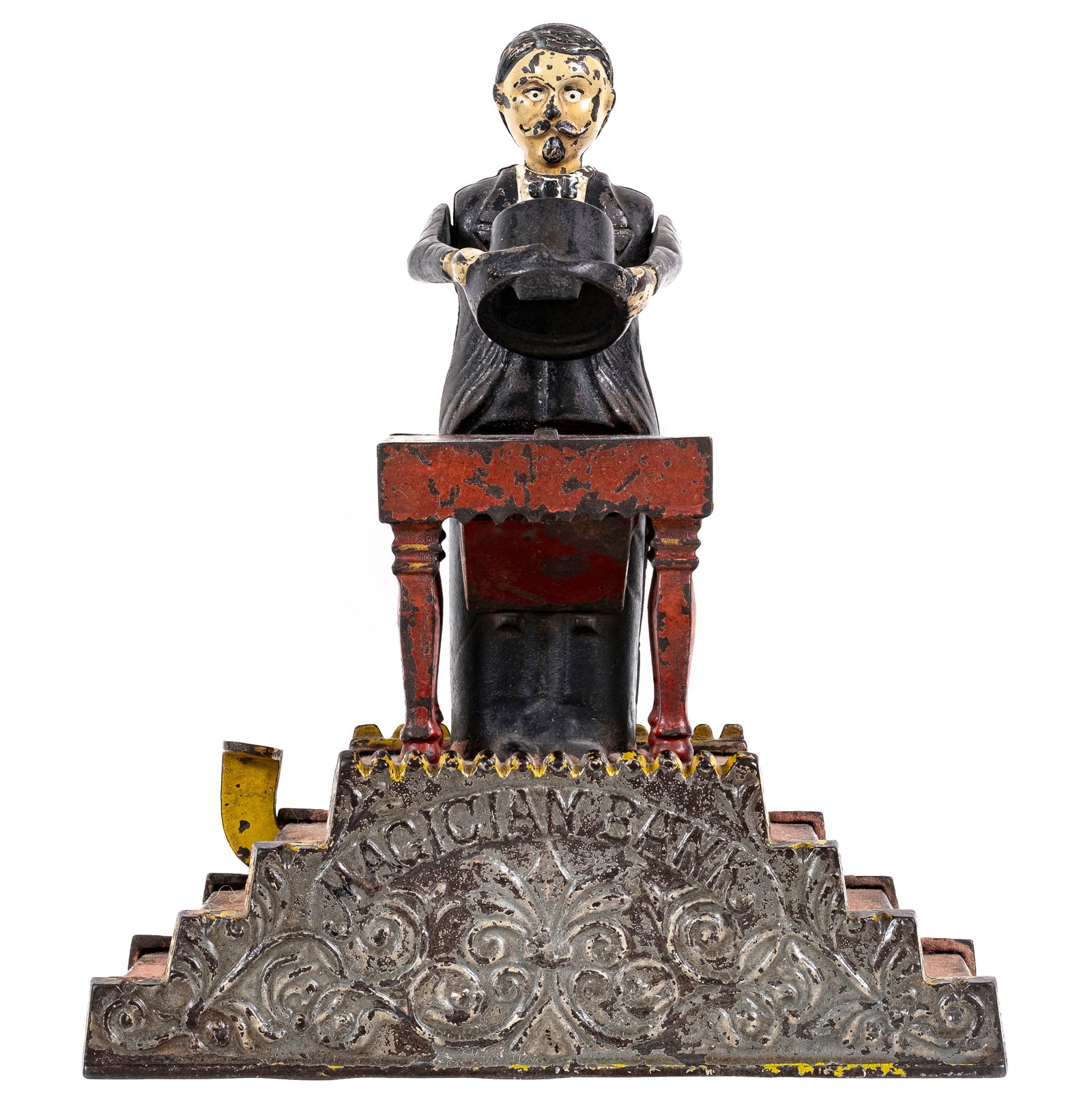 Magician - Cast Iron Mechanical Bank: Made by the J. & E. Stevens Company. Cromwell, Connecticut - Circa 1890's. This is an iconic mechanical bank from the late Victorian Era
