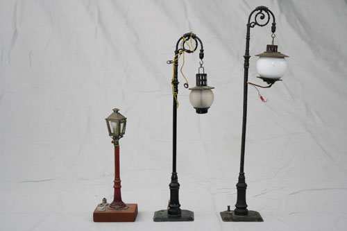 Three Train Lamps: Germany – Circa 1920 Material: Tin and Glass •