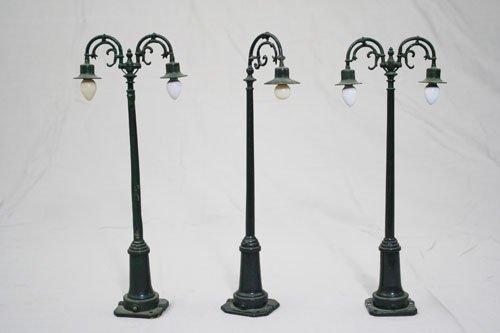 Three Train Lamps: Lionel Corporation • American – Circa 1920’s Material: Cast Lead and Glass •