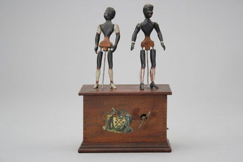 The “Juba” Dancers: Automatic Toy Works Connecticut – Circa 1870 An iconic black clockwork toy. Material: Papier-mâché and Wood