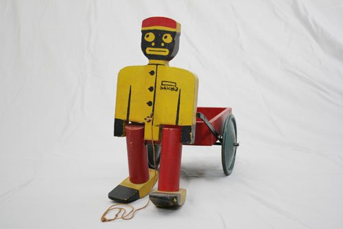 Sambo Pulling a Cart: Made by Velo Walking Pull Toys Philadelphia, Pennsylvania – Circa 1920 15½” long by 12” high. Material: Wood and Sheet Steel
