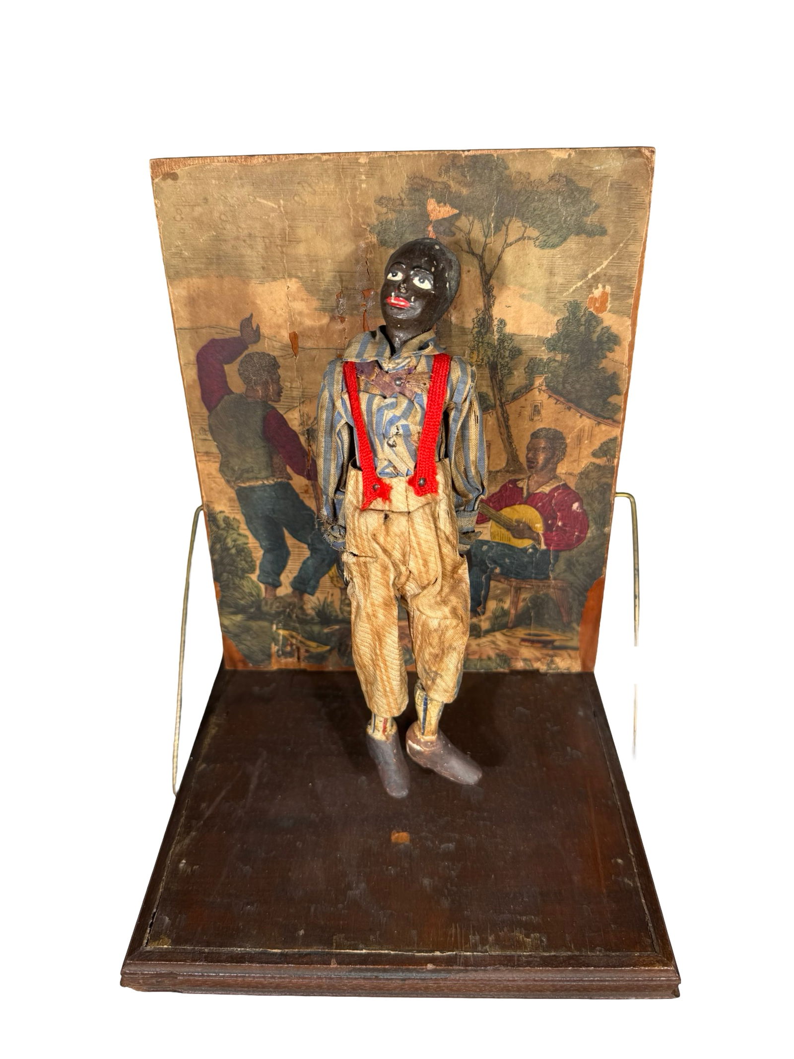 Mechanical Plantation Dancer - Rare version with Wood Platform: Probably by Automatic Toy Works. Connecticut - 1870's - 7" Tall x 7" Wide. This desirable clockwork toy is one of the most sensational wonders from the early period of mechanical toy production in Con
