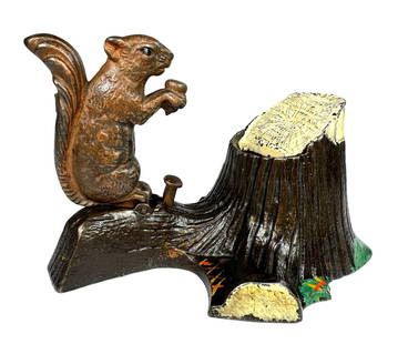 Squirrel and Tree Stump Bank: Made by Mechanical Novelty Works. New Britain, Connecticut - Circa 1881. Like a squirrel who hides his surplus acorns when times are good and nuts are plentiful, the forward thinking child who chooses