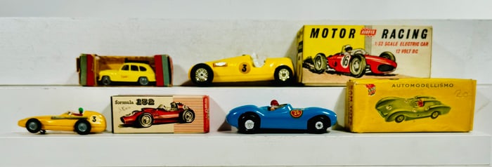 Four Boxed Plastic Autos