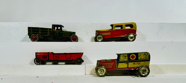 Four Nickel Toy Trucks