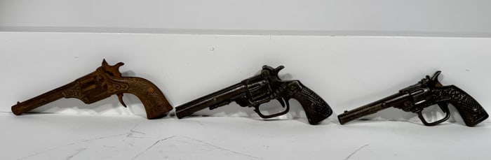 Four Cast Iron Cap Guns
