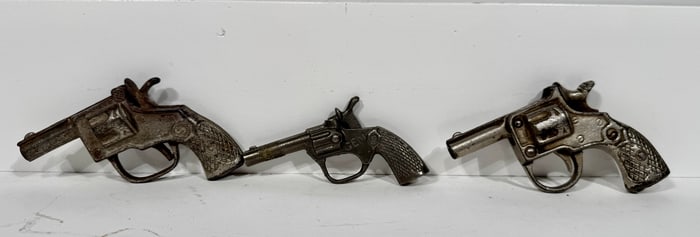 Three Cast Iron Cap Pistols