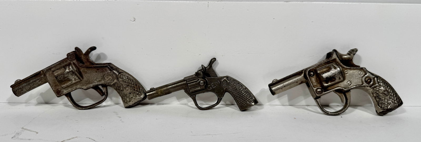 Three Cast Iron Cap Pistols: American - 1930's.