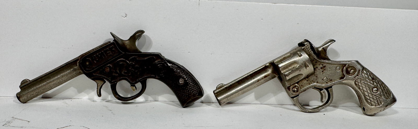 Two Cast Iron Cap Guns: Chief (Kenton) & one other. American - 1910/30's.