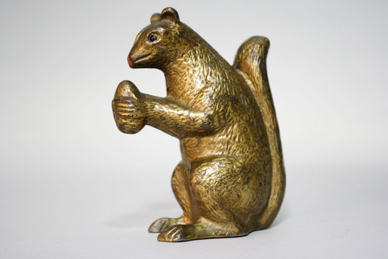 Squirrel with Nut Still Bank: Made by A. C. Williams Ravenna, Ohio – Circa 1910 This is a superior example of the scarce A. C. Williams bank. Material: Cast Iron
