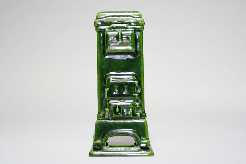 Felix” Stove on Pedestal Base Still Bank: Germany – Circa 1925 This is a bank that we have not seen before. It is porcelain over iron and sits on a separate pedestal base. Material: Cast Iron