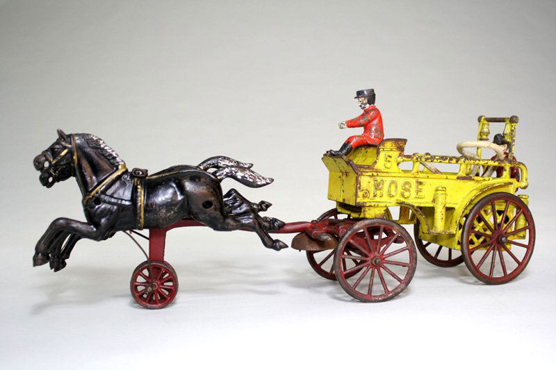 Hose Cart – Large Version Cast Iron: Made by Kenton Hardware Co. Kenton, Ohio – Circa 1900 This is an extremely scarce fire toy apparatus. This is the large version and is 19” long. There are probably only about a dozen or so known.