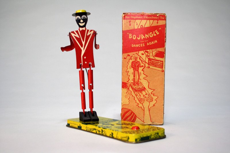 Mr. Bojangles Tapping Toy with Box: Made by Clown Toy Mfg. Brooklyn, New York – Circa 1940’s We have never seen this charming little toy before. It is not a windup, but hand/finger articulated. Material: Tin