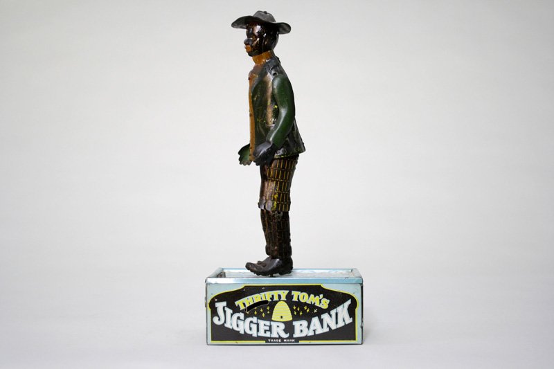 Thrifty Tom’s Jigger Bank: Made by Louis Marx & Co. New York, New York – Circa 1925 This is the mate to the Dapper Dan bank. This bank has a similar action. It also works quite well. Material: Tin